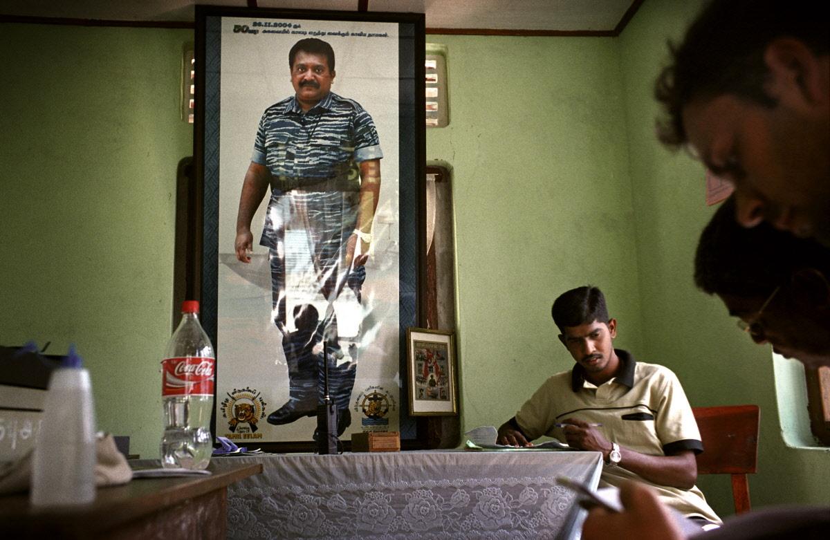 A Tamil Tiger (LTTE) official in Kilinochchi town discusses tsunami relief in the northeastern coast of Sri Lanka, an area also ravaged by civil war.jpg