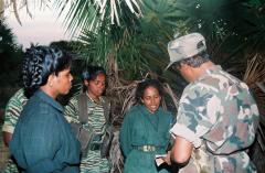 Col. Balraj discussing with Col. Thurka, commander of the Soathiyaa Regiment and Col. Vithusha [right], the commander of Maalathi Regiment.jpg