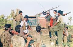 Commander Balraj with his fighters on an Armoured Personnel Carrier seized by the Tigers in Iththaavil.jpg