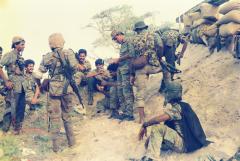 Balraj with Soosai and fellow fighters at a the captured part of EPS base during the first LTTE operation on EPS base.jpg