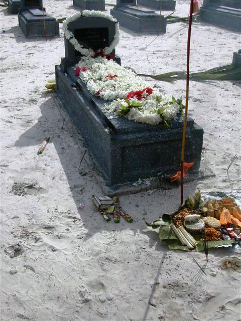 Food and flower offerings by relatives.jpg