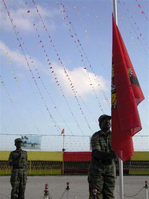 The flag of Tamil Eelam being hoisted by Colonel.Gokulan at the Elephantpass memorial site in early morning on Martyr's day.jpg