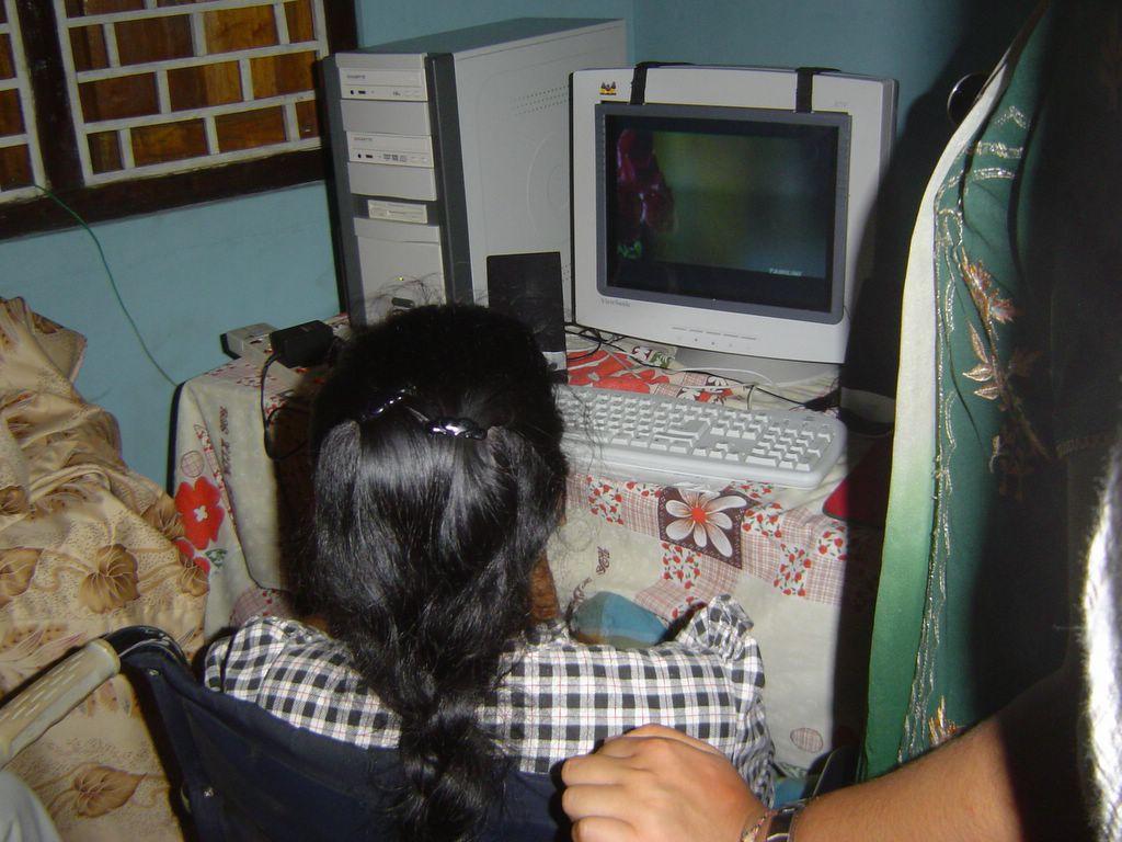 Watching a video greeting made by a soldier from Mayuri Illam. Posted by Hello.jpg