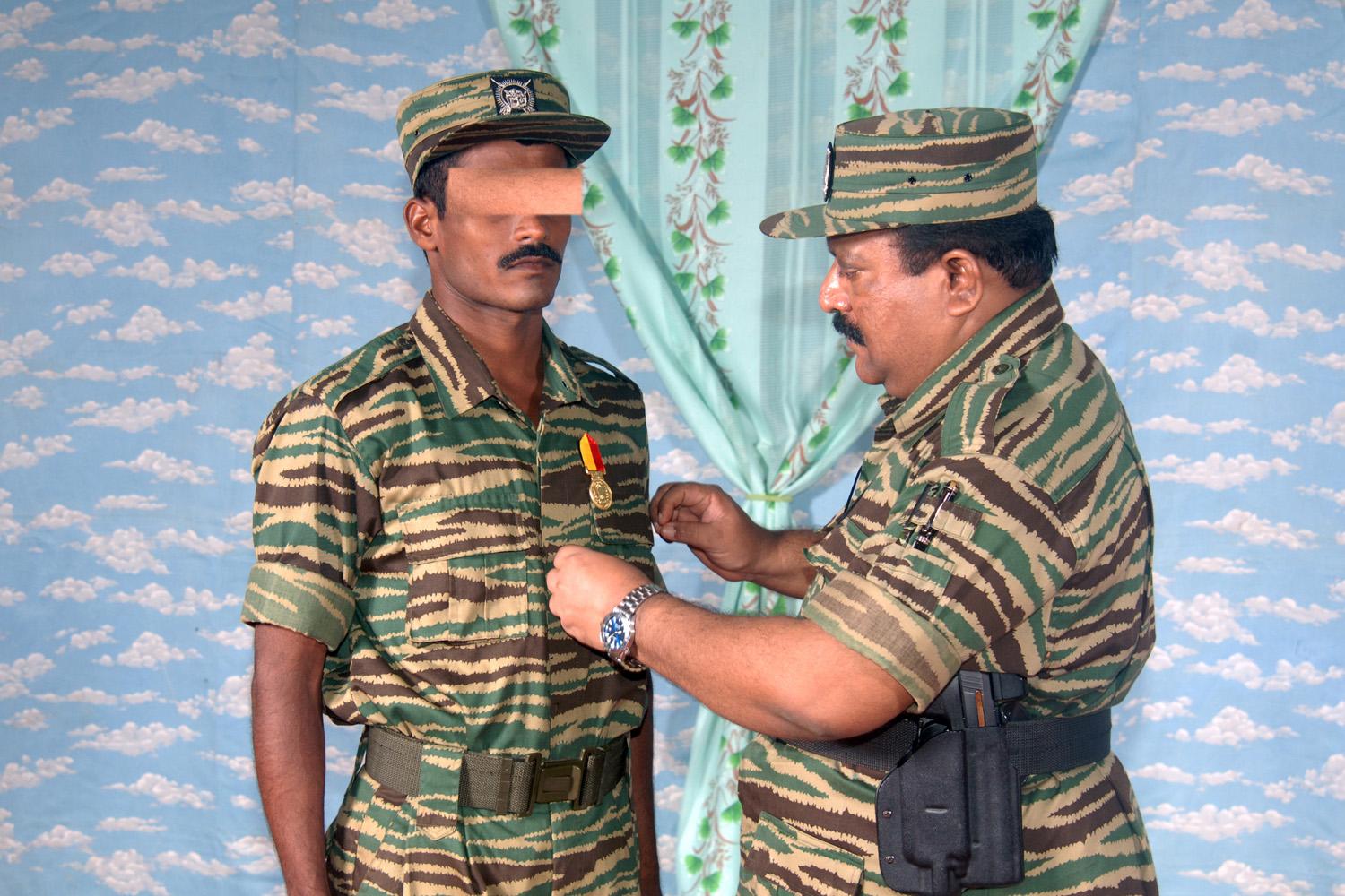 An LTTE commando decorated by a olinjaayiru medal by the Tiger leader 01 November 2007.jpg