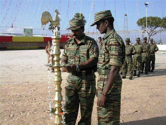 LTTE's Jaffna Political wing leader S.Ilamparithy lights the oil lamp at the Elephantpass memorial site in early morning on Martyr's day.jpg
