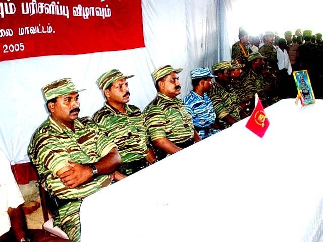 l-r-mr-elilan-mr-vasanthan-and-colonel-sornam-are-seated-at-the-head-table-with-other-ltte-activists.jpg