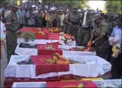 The funeral of seven members of Liberation Tigers of Tamil Eelam and a civilian rural force member killed in Sri Lanka Air Force SLAF air strike on LTTE's Thenham Conference Centre on 29-7-2006.jpg