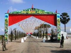 A9, Jaffna-Kandy highway decorated with read and yellow flags and cut outs at the Elephantpass memorial site in early morning on Martyr's day.jpg