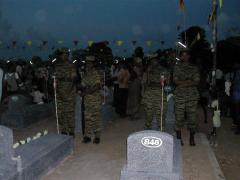 Female cadres pay attention to their leader's martyr's day speech being broadcast live in the graveyard- 2005 visuvamadu.jpg