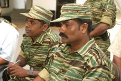 Mr. Ramanan, the chief of LTTE's military intelligence for the Batticaloa Amparai district with Mr. Ram (in the background), a senior LTTE commander from the east..jpg
