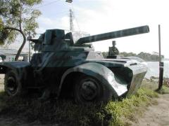An LTTE cadre guards the tanker captured by them.It is painted and kept at the Elephantpass memorial site in early morning on Martyr's day.jpg