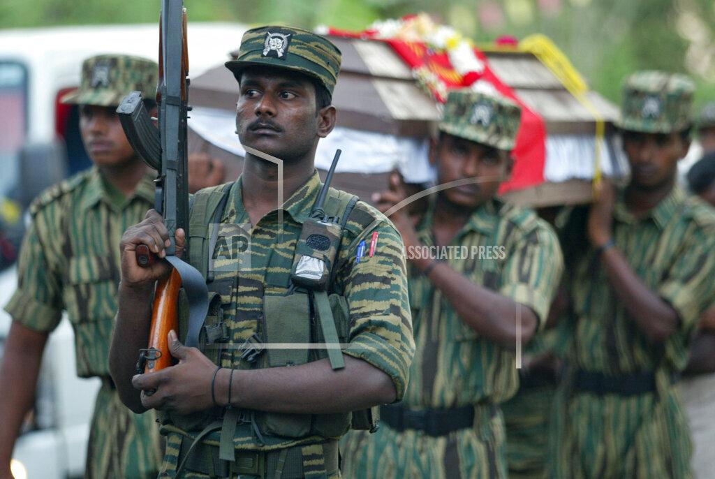 Tamil rebels carry the coffin of Eliyathambi Kathrchewan, a Tamil Tiger rebel known as Lt. Col Arjunan, at the Viswamadu cemetery , april 20 2007.jpg
