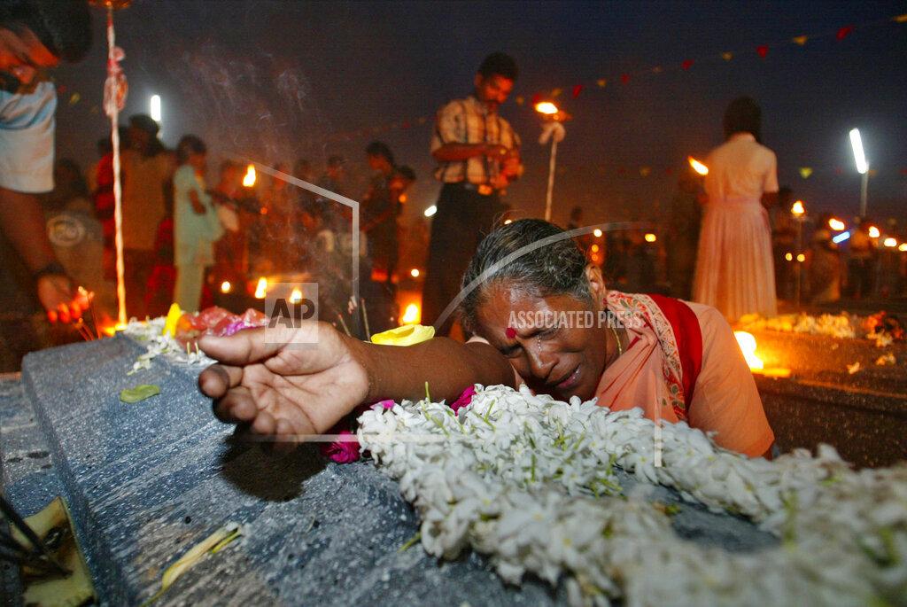 Vigneswaran Eswari cries at the grave of her daughter who lost her life fighting for the Liberation Tigers of Tamil Eelam, at Viswamadu cemetery, in rebel controlled town of Mulathivu  2005.jpg