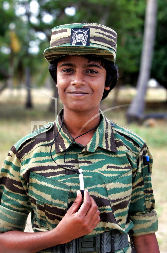Prithvi, 23, a Tamil Tiger rebel shows her cyanide capsule, at an undisclosed location in northern Tamileelam, June 21, 2006. In 2009 she became a Land Black Tiger and when she blasted she was posthumously promoted to the rank Lt. Col. .jpg