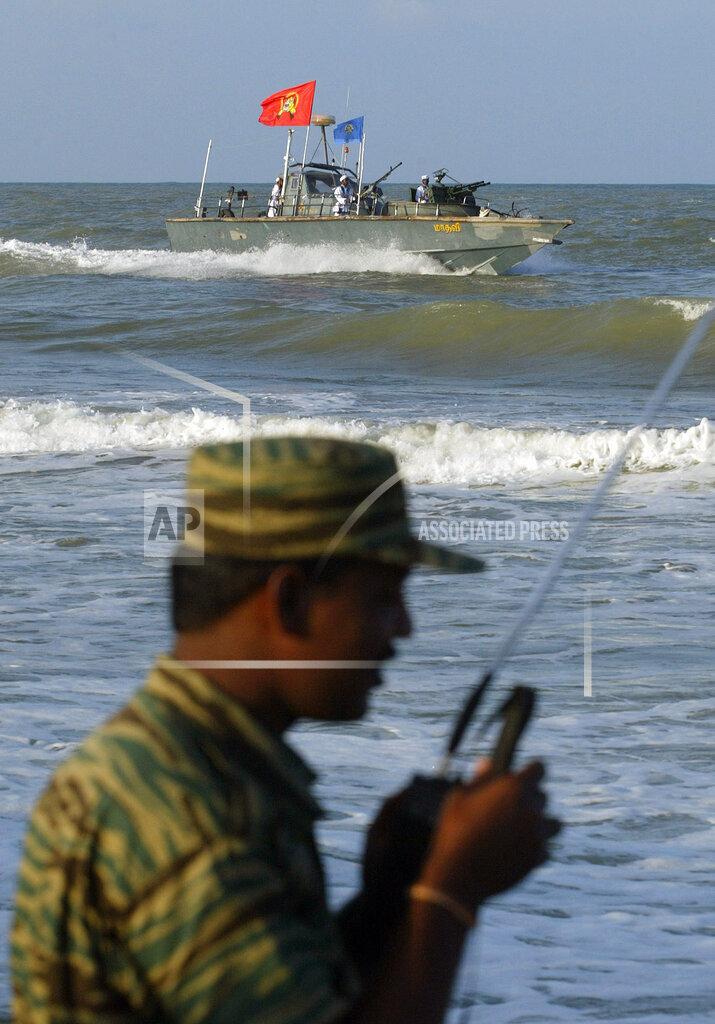 ltte sea tigers Gunboat ... with walki- Lt. Col. Cheziyan.jpg