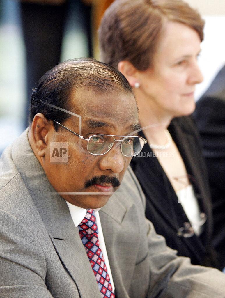head of delegation Anton Balasingham, left, and his wife Adele Balasingham, take their seats prior to their two-day meeting , feb 22.jpg