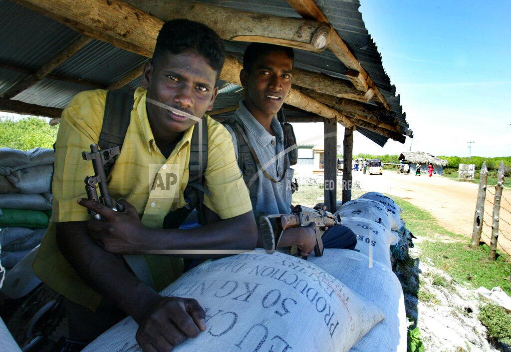 sept 9, 2005 Liberation Tigers of Tamil Eelam fighters man a check post in rebel controlled area of Kokkadichcholai,.jpg