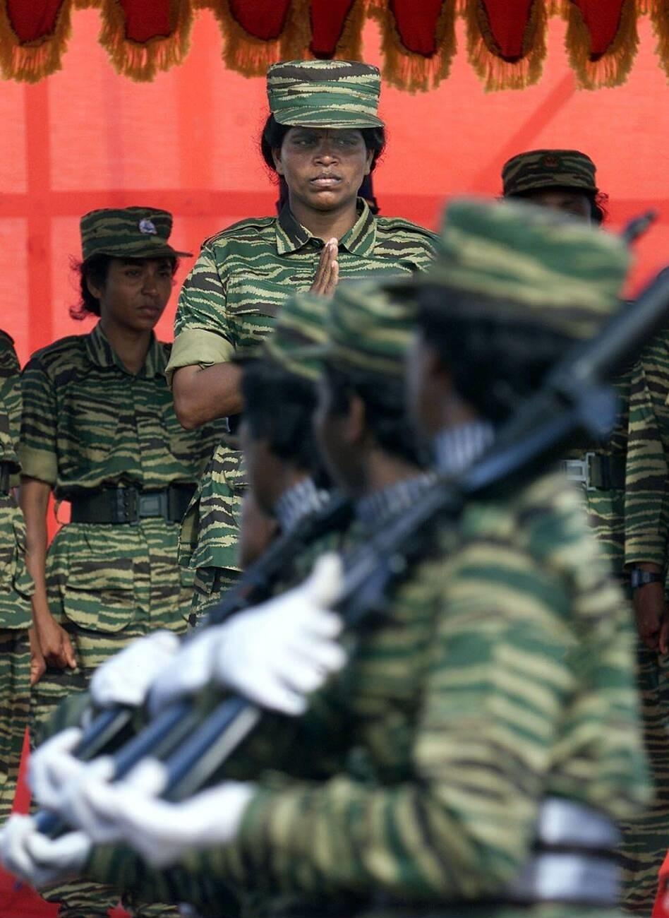 the-special-commander-of-the-LTT-Malathy-Regiment-Brigadier-Thurka-alias-Yazhini-receives-a-guard-of-honour-from-Kuttisri-Mortar-Brigade-during-womens-day-celebration-in-Kilinochchi-standing-right-behind-her-the-commander-of-the-Thilaka-regiment-Oct-10-02