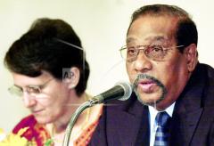 Anton Balasingham, right, is accompanied by his wife and Secretary of the LTTE Adele Balasingham at the opening ceremony of talks at a hotel in Pattaya, Thailand, Monday, Sept. 16, 2002..jpg