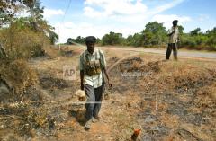 Searching for road side bomb, Tamil Eelam Civil Force members