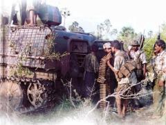 'SamarkkaLa Nayakan' Brigadier Balraj - Deputy Commander of Tamileelam Military standing next to a captured T-63 APC of SLA during the operation Unceasing Waves-3 phase 4 (inside the Iththavil Box)