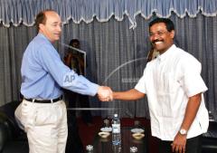 Political chief of the Tamil Tiger rebels S.P. Tamilselvan, right facing camera, addresses a press conference after his meeting with Norway ambassador to S.jpg