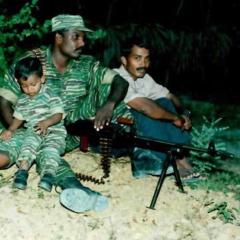 tamil tiger cadre with his child.jpg