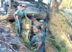 LTTE removing the guns from a destroyed SLA's MBT.jpg