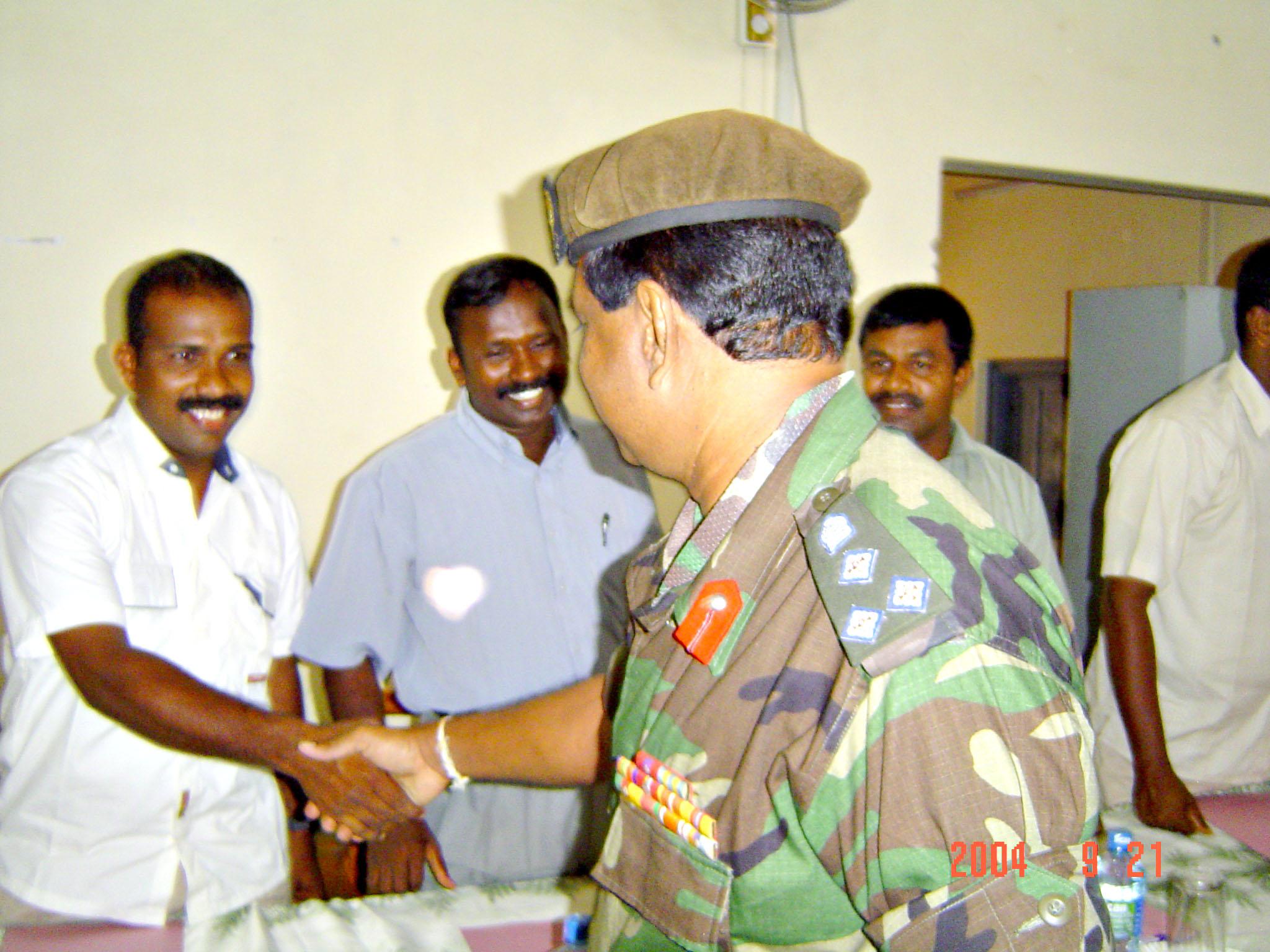 L-R- Brig Wijegunawardena shaking hands with Mr. Dayamohan, Lt. Col.  Kousalyan and Mr. Marshall - 22 September 2004