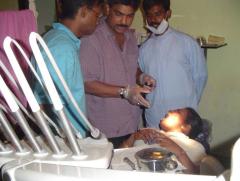 Dentists Sivakanesan and Sivapiran from Norway working with a patient to train local medical practitioners..jpg