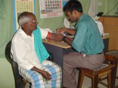 Locally trained lab technician prepares to get blood sample from a patient in a well equiped laboratory..jpg