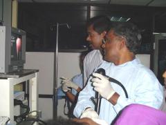Dr Moorthy, a Gastro-enterologist from California, USA helping Dr Sivapalan in diagnosing a patient..jpg