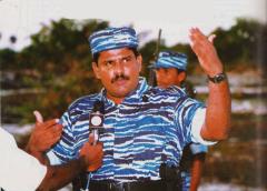 The Sea Tigers, Tamileelam Navy's special commander Col. Soosai was interviewed by a Tamil journalist in 2006 in a Sea Tiger base located in Mullaitivu. His bodyguard is seen standing behind him carrying an M16.