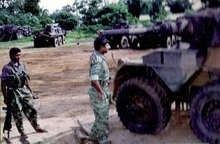 Tiger commander Brigadier Theepan with a captured vehicle from Kanakarayan Kulam military base of SLA.jpg