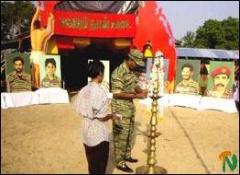 trinco_maaverarnaal_3_251102 Mr.Tilak, Trincomalee district LTTE political head is seen lighting the traditional oil lamp at Sampoor Maveerar Day celebrations.jpg