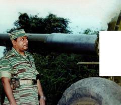 Tamil Tiger leader with a freshly captured 152 mm artillery gun.jpg
