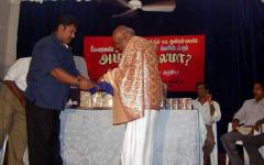 Mr.Ratha hands over the first copy of the film Amma Nalama to Hindu chief priest Bramasiri Ravichandrakurukkal.jpg