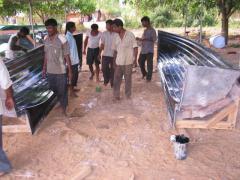 Workers inspecting the main molds after the fiber glass layers are allowed to dry for up to 12 hours..jpg