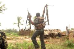 an-ltte-fighter-in-clearing-operation-with-seized-weapons-from-the-sla.jpg