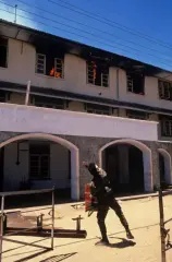 LTTE militant throwing hand grenade into police station, Batticaloa, 1990.webp