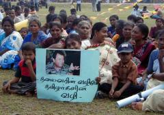 A section of women with LTTE leader's photo at the TNA election rally in Thampalakamam.jpg