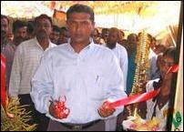 Mr.V.Yusuf, Tampalakamam Divisional Secretary opens the LTTE office cutting the ribbon..jpg