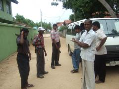 TMVP child soldiers - Athula Vithanage pretendes taking notes, our diver and TMVP carder and our van - photo by Uvindu Kurukulasuriya.jpg